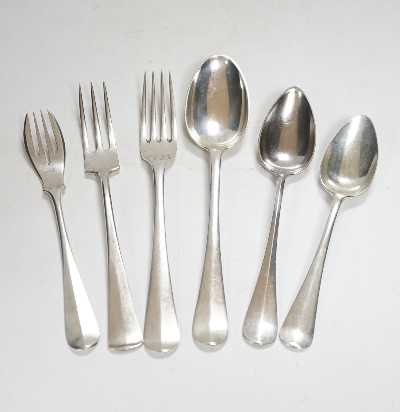 A large quantity of assorted Dutch 833 standard white metal flatware, comprising sixty eight items, 115.4oz, together with seven items of silver plated flatware.